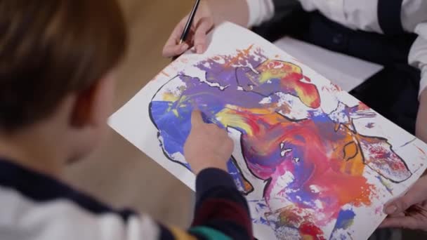Analyzing of childs drawing at psychotherapist — Video