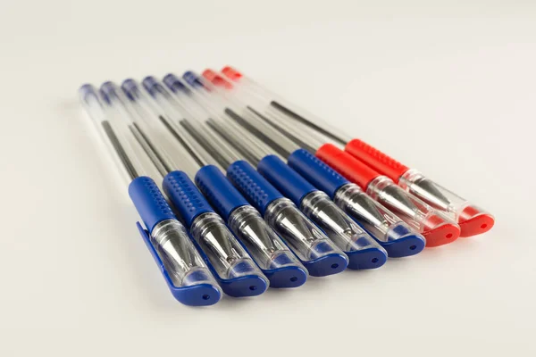 Set Blue Ballpoint Pens Lined Hardly White Backgroun — Stock Photo, Image