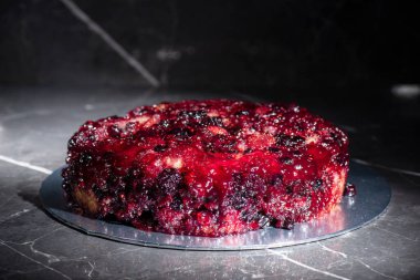 Home-made upside-down cake with mixed berries including organic strawberries, blueberries, blackberries, and raspberries.