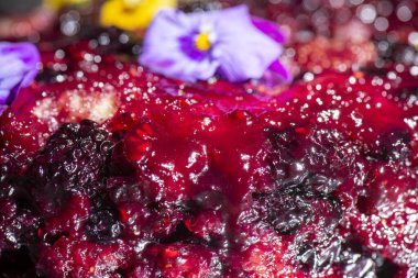 Home-made upside-down cake with mixed berries including organic strawberries, blueberries, blackberries, and raspberries.