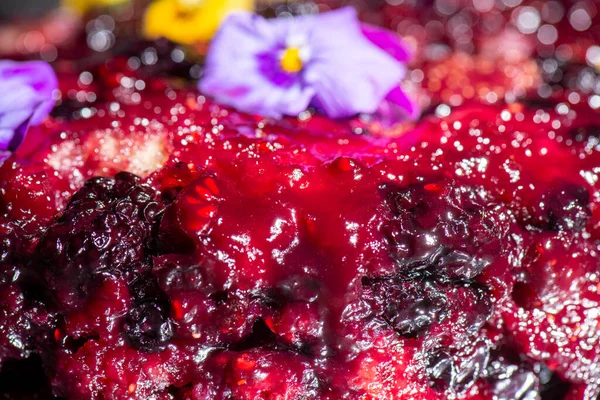 Home-made upside-down cake with mixed berries including organic strawberries, blueberries, blackberries, and raspberries.