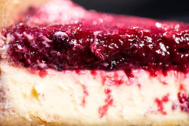 Homemade mixed berry cheesecake with a biscuit crumb and fruit puree.