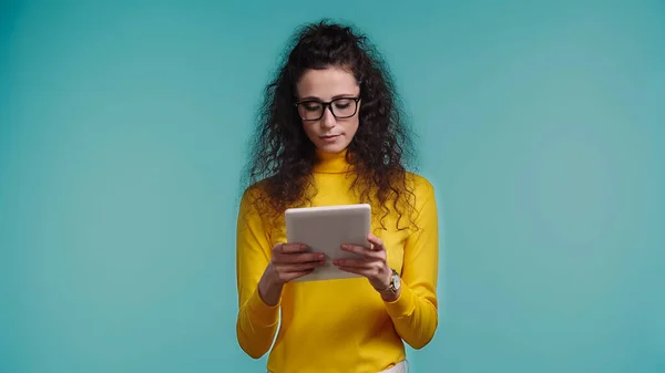 Young Curly Woman Glasses Using Digital Tablet Isolated Blue — Stock Photo, Image
