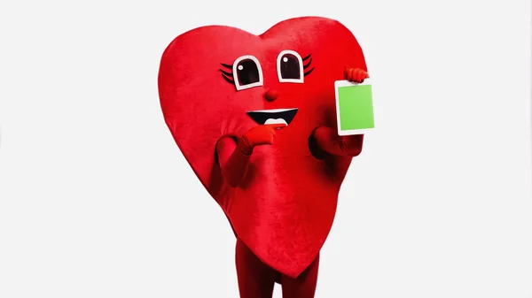 Людина Червоному Костюмі Серця Вказує Цифровий Планшет Зеленим Екраном Ізольовано — стокове фото