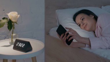 Geceleri yatakta akıllı telefon kullanan gülümseyen bir kadın. 