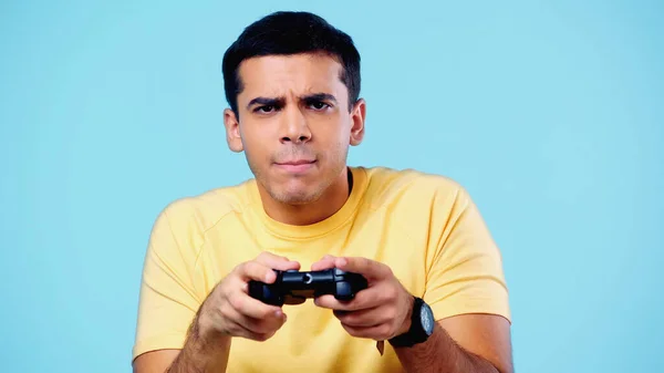 Gamer using controller to play online video games on computer. Man playing  game with joystick and headphones in front of monitor. Player having gaming  equipment, doing fun activity Stock Photo - Alamy