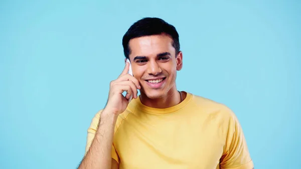 Positive Young Man Yellow Shirt Talking Cellphone Isolated Blue — Stock Photo, Image