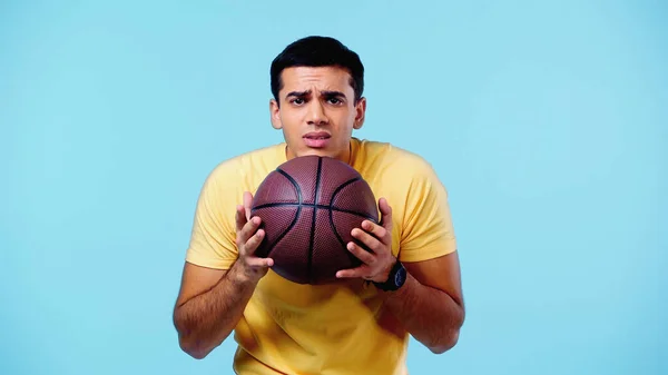 Scared Man Yellow Shirt Holding Basketball Isolated Blue — Stock Photo, Image