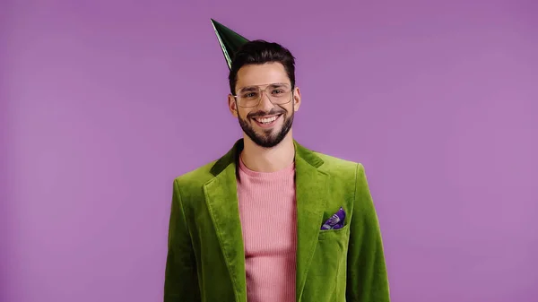 Cheerful Man Green Jacket Party Cap Smiling Isolated Purple — Stockfoto