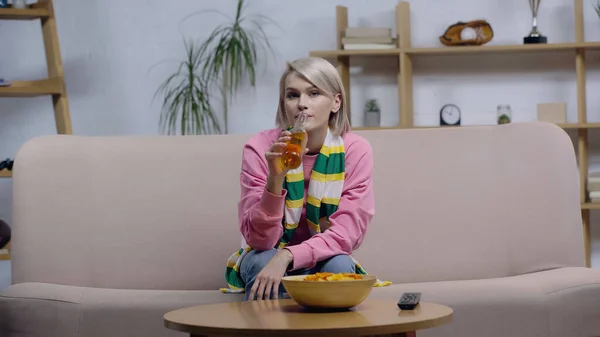 Blonde Sport Fan Woman Striped Scarf Drinking Beer Watching Championship — Stock Photo, Image