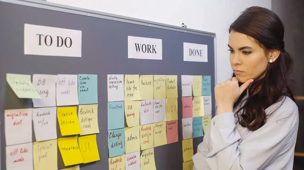 Pensive Businesswoman Thinking Colorful Sticky Notes Board — Fotografia de Stock