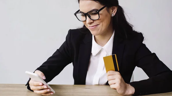 Pleased Businesswoman Holding Smartphone Credit Card Isolated White — Foto de Stock