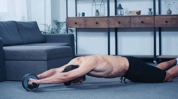 Shirtless Sportsman Exercising Fitness Wheel Floor Home — Stock Photo, Image