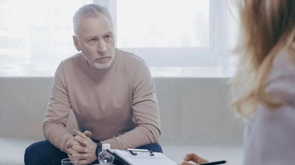 Middle Aged Man Clenched Hands Sitting Couch Psychotherapist — Fotografia de Stock