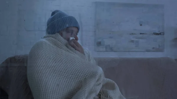 Diseased Man Warm Hat Blanket Sneezing Paper Napkin Couch Home — Zdjęcie stockowe