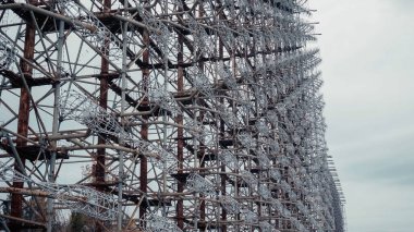 steel radar station in chernobyl exclusion zone under grey cloudy sky