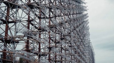 steel radar station in chernobyl exclusion zone under grey cloudy sky clipart