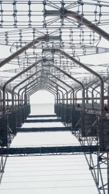 bottom view of steel construction of telecommunication tower in chernobyl