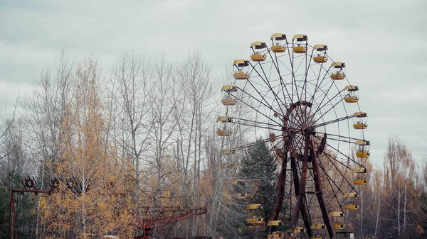 old ferris wheel in amusement park of chernobyl abandoned city