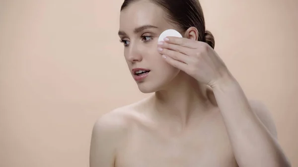 Young Woman Bare Shoulders Holding Cotton Pad Face Isolated Beige — Stockfoto