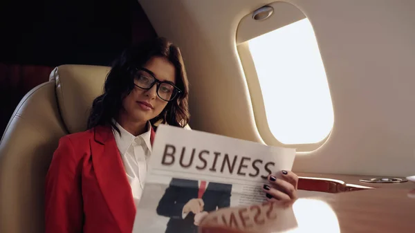 Businesswoman Eyeglasses Reading Newspaper Private Jet — Stock Photo, Image