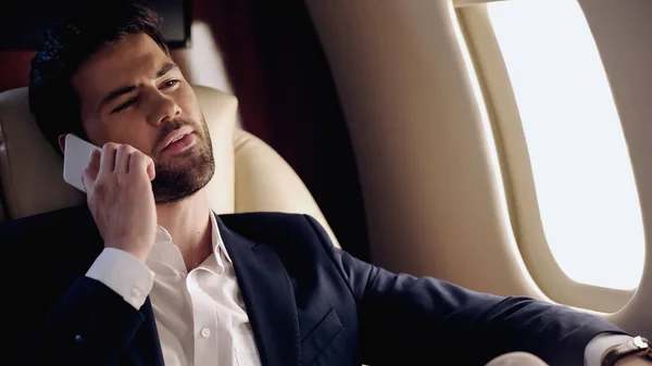 Businessman Suit Talking Smartphone Private Plane — Foto de Stock