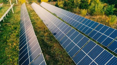 Aerial view of solar panels on field clipart