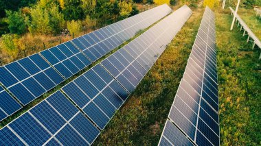 Aerial view of solar panels system on field  clipart