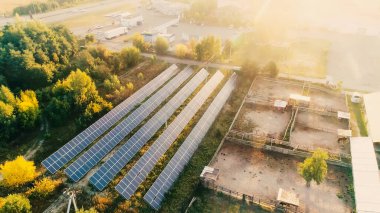 Aerial view of solar panels near trees 