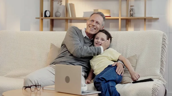 Cheerful Middle Aged Grandfather Hugging Happy Grandson While Watching Movie — Stock Photo, Image