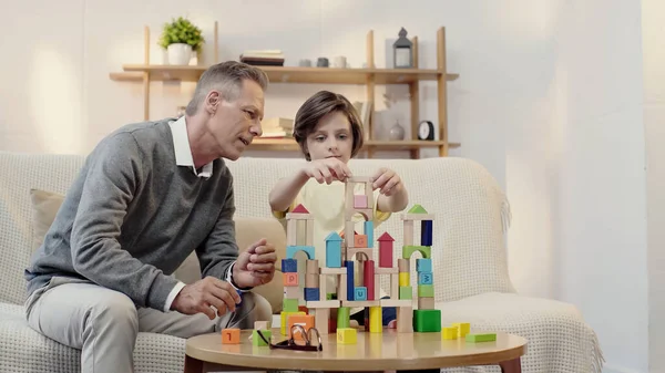 Middle Aged Grandfather Playing Building Blocks Preteen Boy — Φωτογραφία Αρχείου