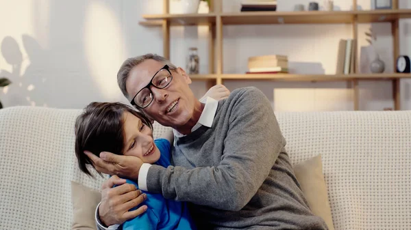 Happy Middle Aged Man Glasses Hugging Grandson — Stockfoto