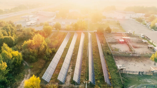 Aerial view of solar panels at sunset 