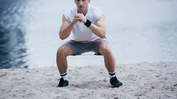 Cropped View Athletic Sportsman Doing Squat Exercise River Shore — Stock Photo, Image