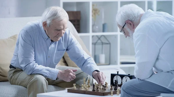 Grey Haired Man Playing Chess Senior Friend Living Room — 图库照片