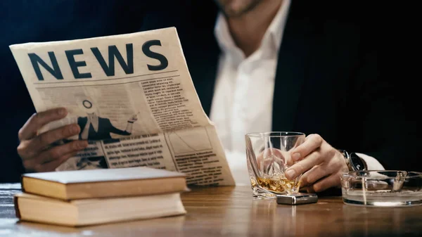Cropped View Businessman Reading Newspaper Holding Glass Whiskey Books Isolated — 스톡 사진