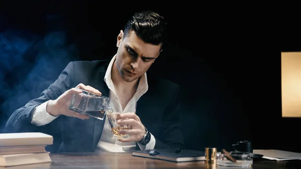 Businessman Pouring Whiskey Books Cigar Black Background Smoke — Fotografia de Stock