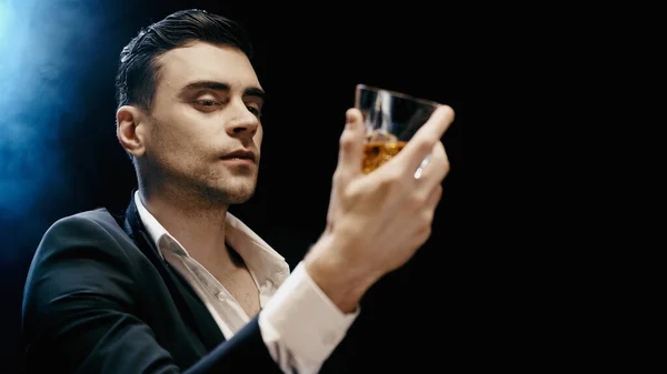 Businessman Looking Blurred Glass Whiskey Black Background Smoke — Foto Stock