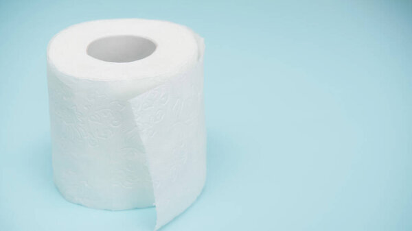 soft and white toilet paper on blue background 