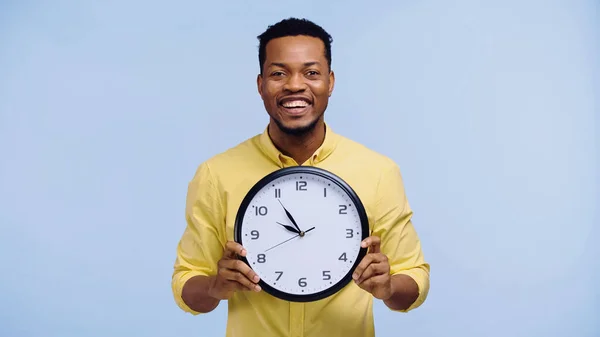 Cheerful African American Man Holding Clock Looking Camera Isolated Blue — Stock Photo, Image