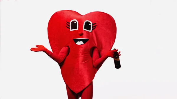 Person in heart costume holding bottle with wine isolated on white — Stock Photo