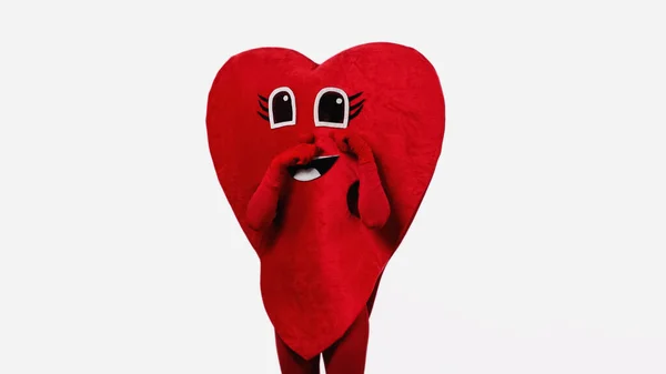 Triste persona en forma de corazón traje tocando los ojos de dibujos animados mientras imita llorando aislado en blanco - foto de stock