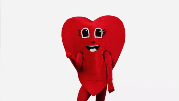 Людина в щасливому червоному костюмі серця танцює ізольовано на білому — стокове фото