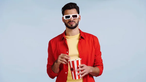 Disappointed man in 3d glasses watching movie isolated on blue — Stock Photo