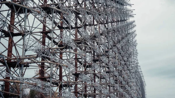 Steel radar station in chernobyl exclusion zone under grey cloudy sky — стоковое фото