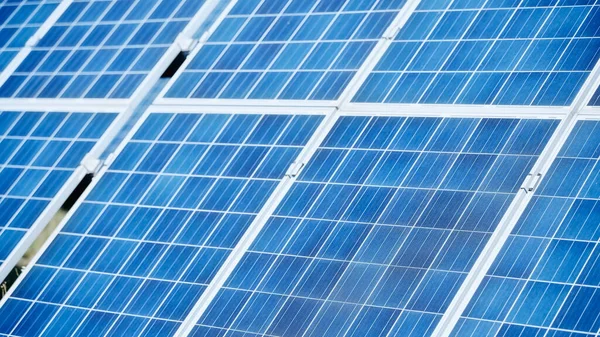Blue construction of solar batteries outside — Stock Photo