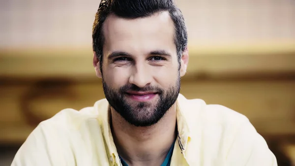 Cheerful and bearded man looking at camera — Stock Photo