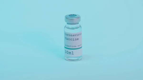 Glass bottle with coronavirus vaccine and injection only lettering on blue background — Stock Photo