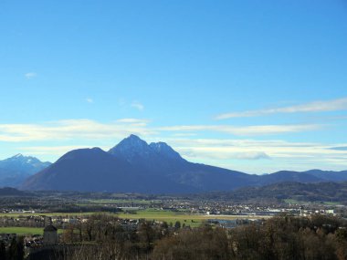 Panorama of the Austrian countryside near Salzburg.Plains and mountains on a sunny day.
