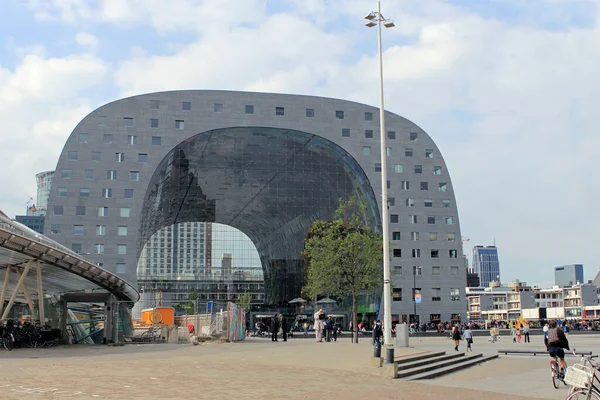 Rotterdam Market Hall.Facade of the famous curved palace with strolling tourists.